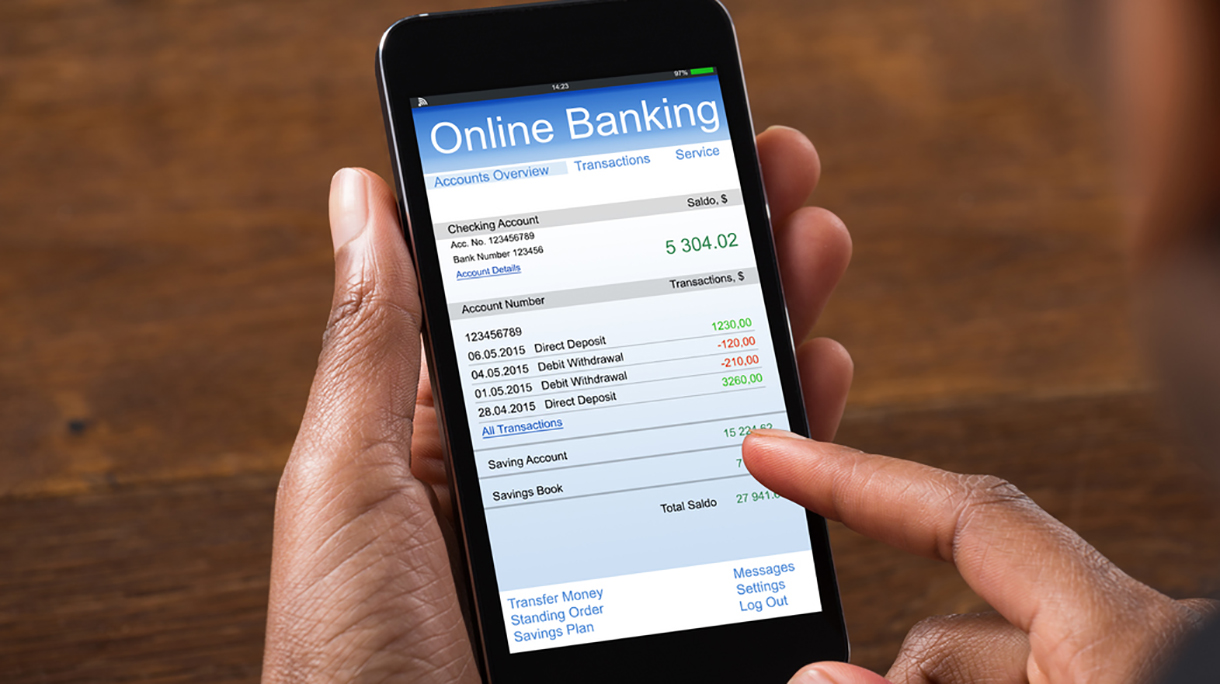Businesswoman Using Online Banking Service On Mobile Phone