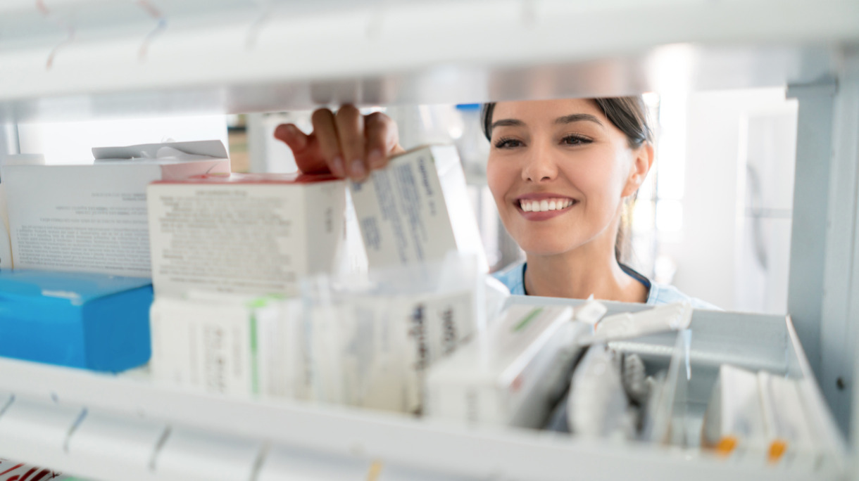 portrait-of-pharmacist-looking-for-prescribed-medications-in-the-picture-id646686748