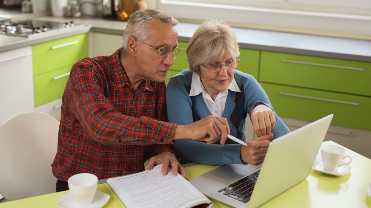 senior-couple-is-using-laptop-to-organize-their-finances-picture-id6412734861
