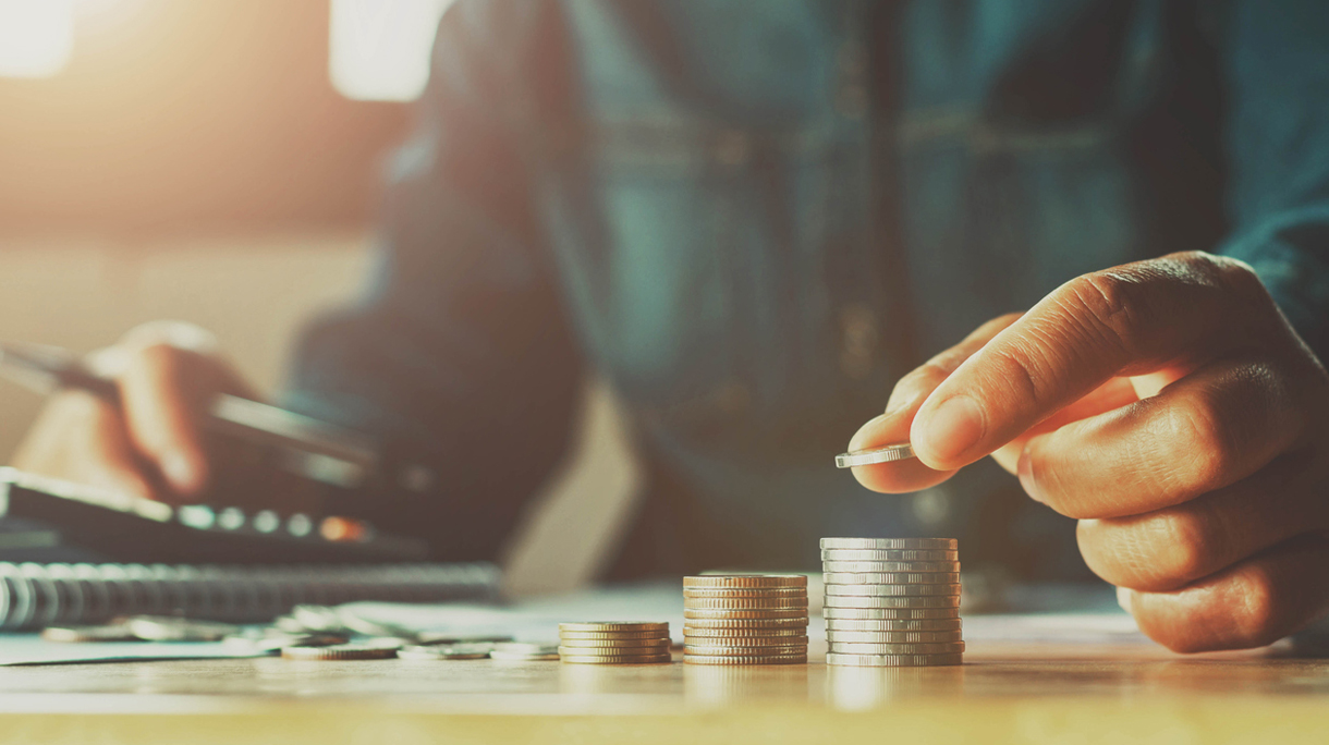Saving money woman hand putting coin stack concept business finance