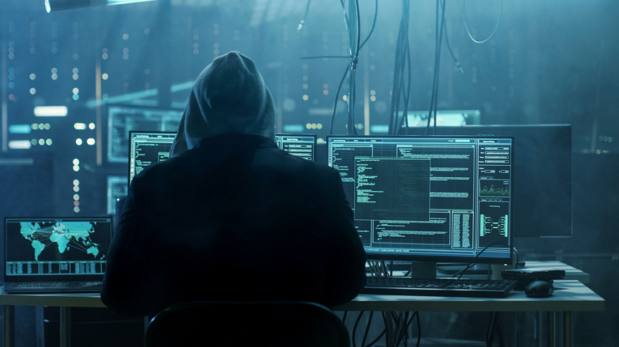 dangerous-hooded-hacker-breaks-into-government-data-servers-and-a-picture-id817486228