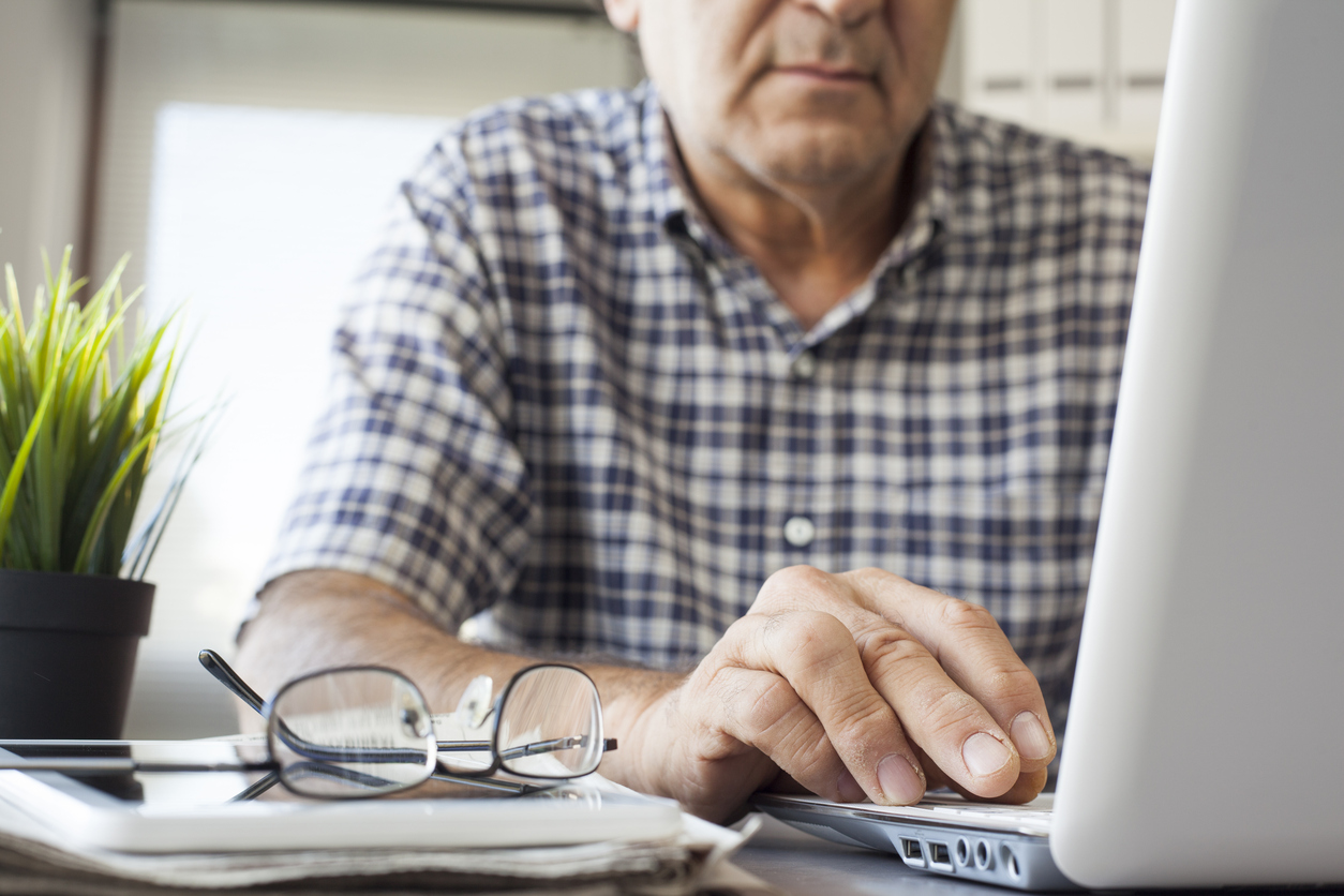 Senior man working on computer