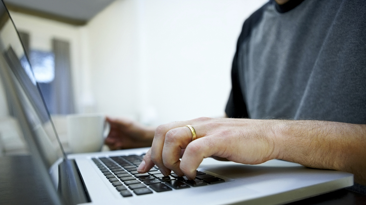 Man hands working on laptop
