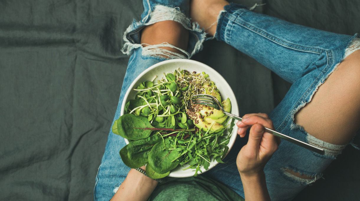 vegetarian-breakfast-bowl-with-spinach-arugula-avocado-seeds-and-picture-id692990626