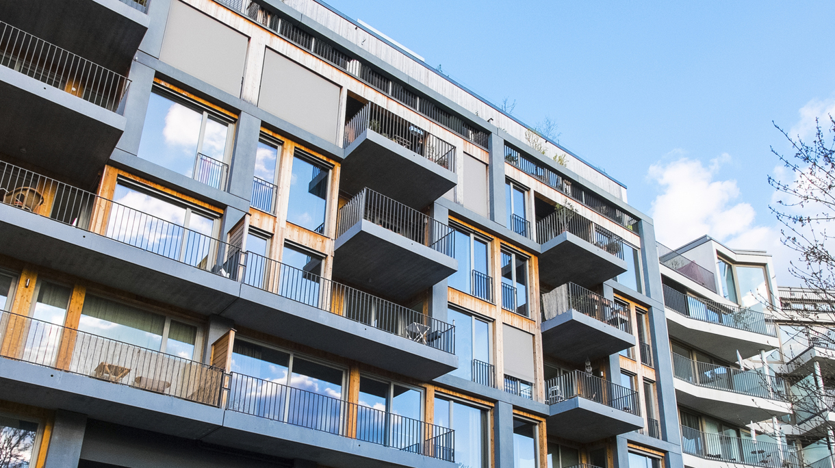 modern apartments with balconys and blue sky