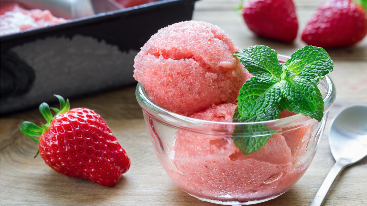 homemade-strawberry-sorbet-in-glass-on-a-wooden-table-picture-id526132610