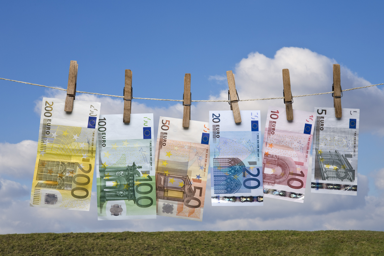 Wet Euro banknotes hanging on a clothes line