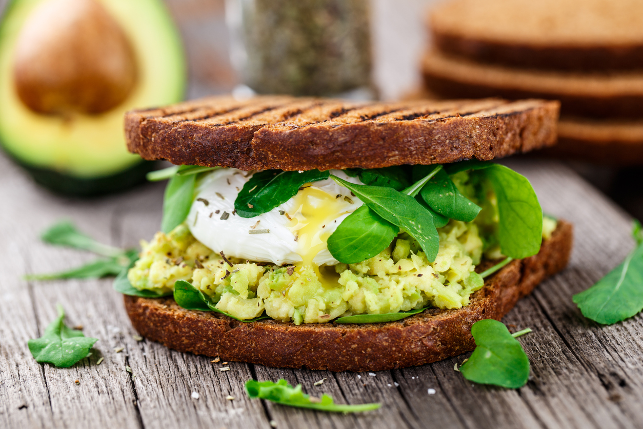 Sandwich with avocado and poached egg