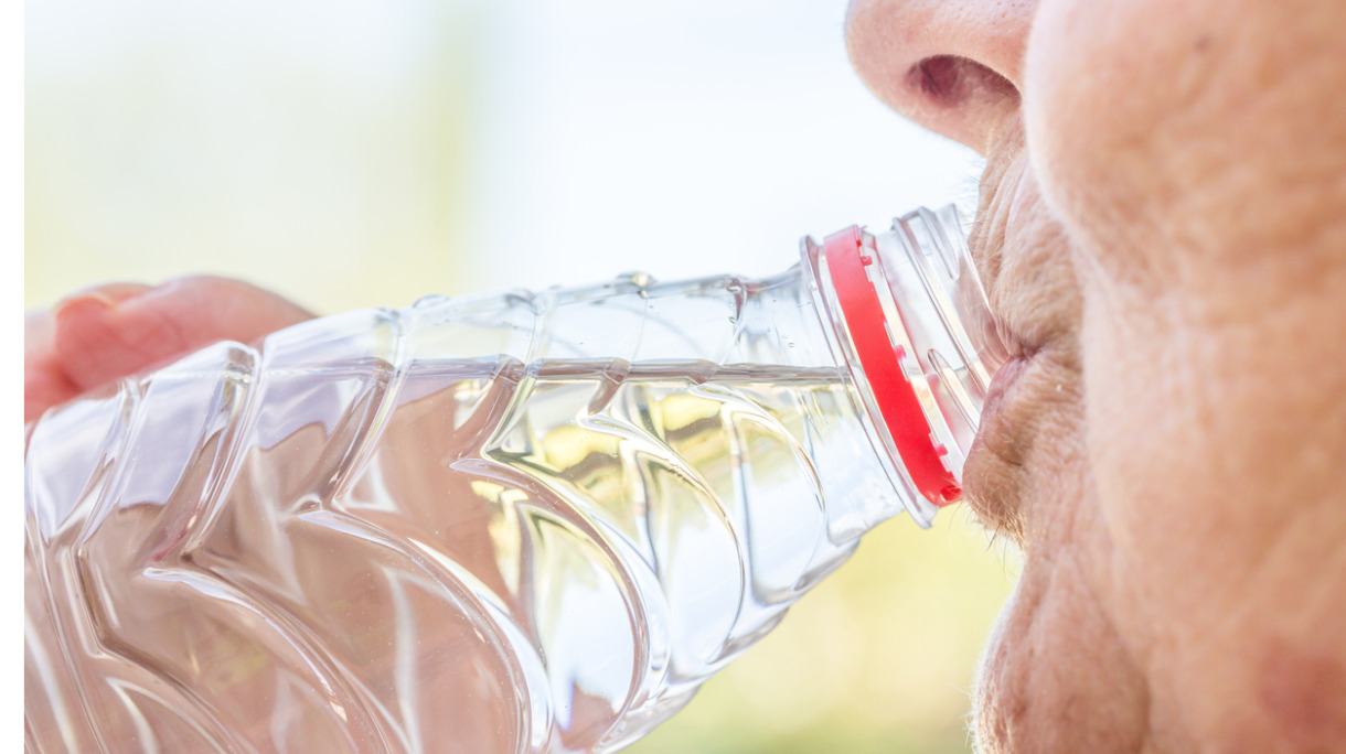 senior-woman-drinking-fresh-water-from-the-bottle-picture-id654578144