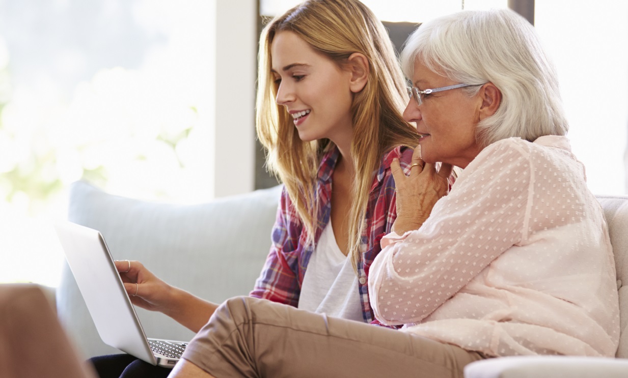 Adult Granddaughter Helping Grandmother With Computer