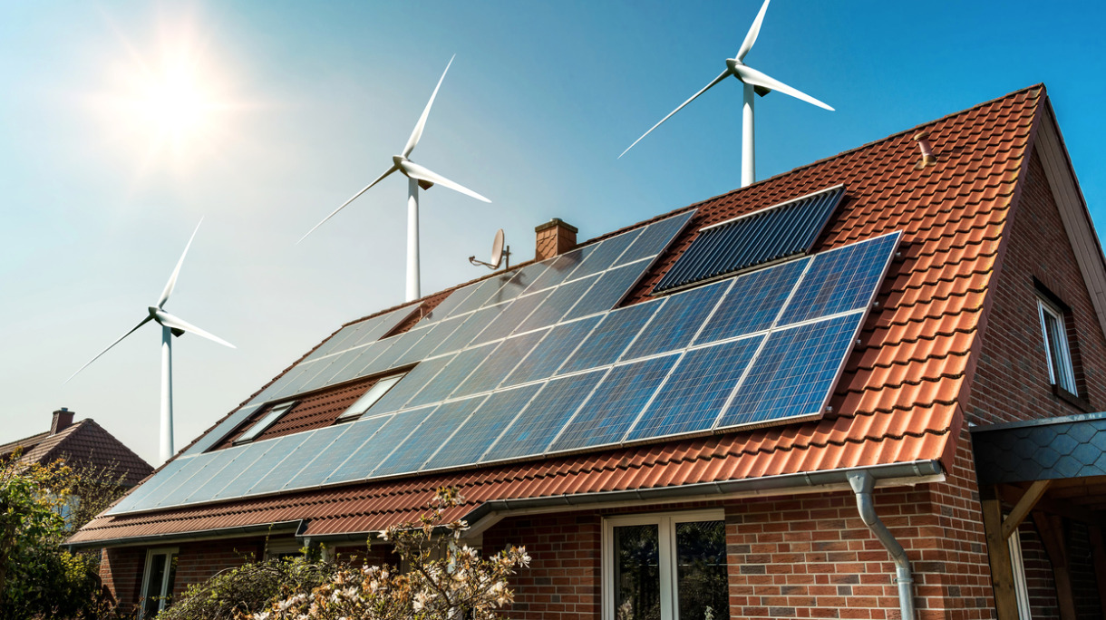 solar-panel-on-a-roof-and-wind-turbins-arround-picture-id641260798