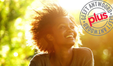beautiful-african-american-woman-smiling-with-sunset-picture-id522324004_1