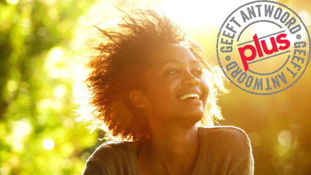 beautiful-african-american-woman-smiling-with-sunset-picture-id522324004_1