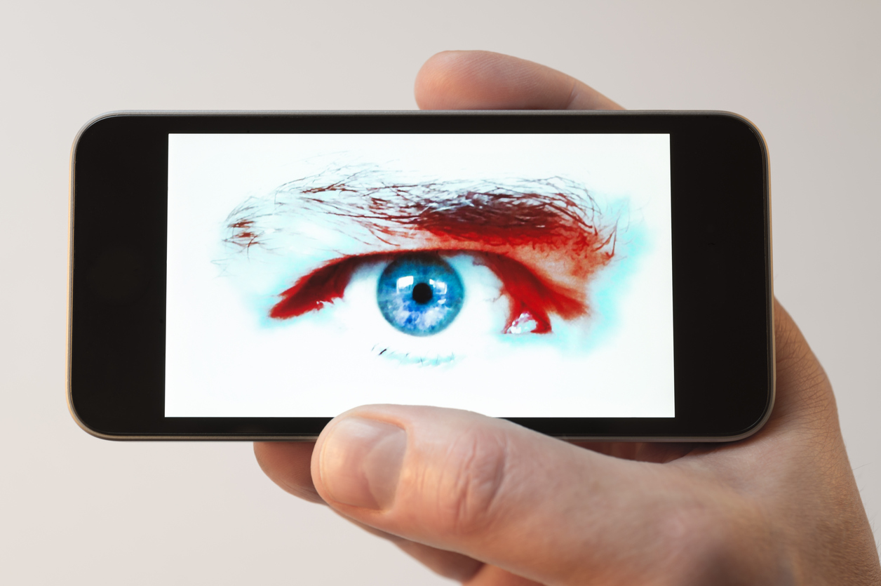 Staring eye on cellphone screen