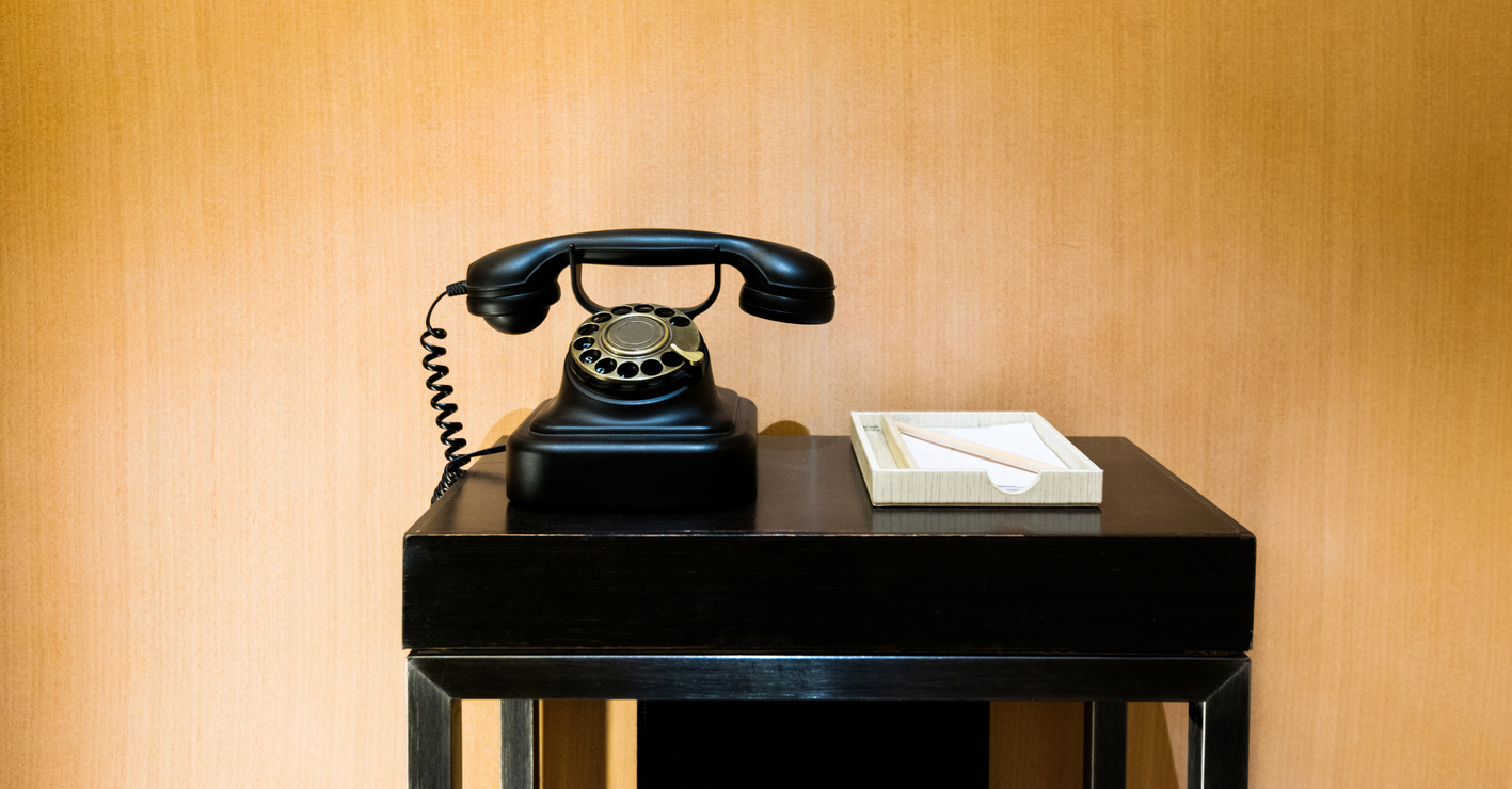 Retro telephone on a wooden table