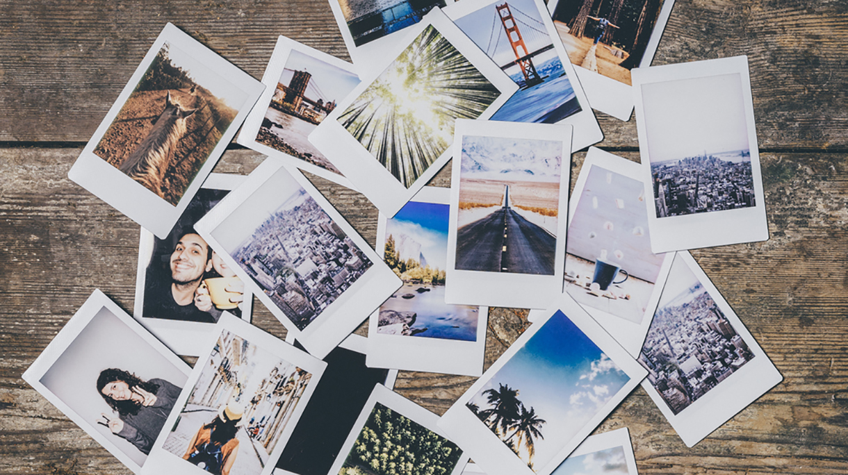 Instant camera prints on a table
