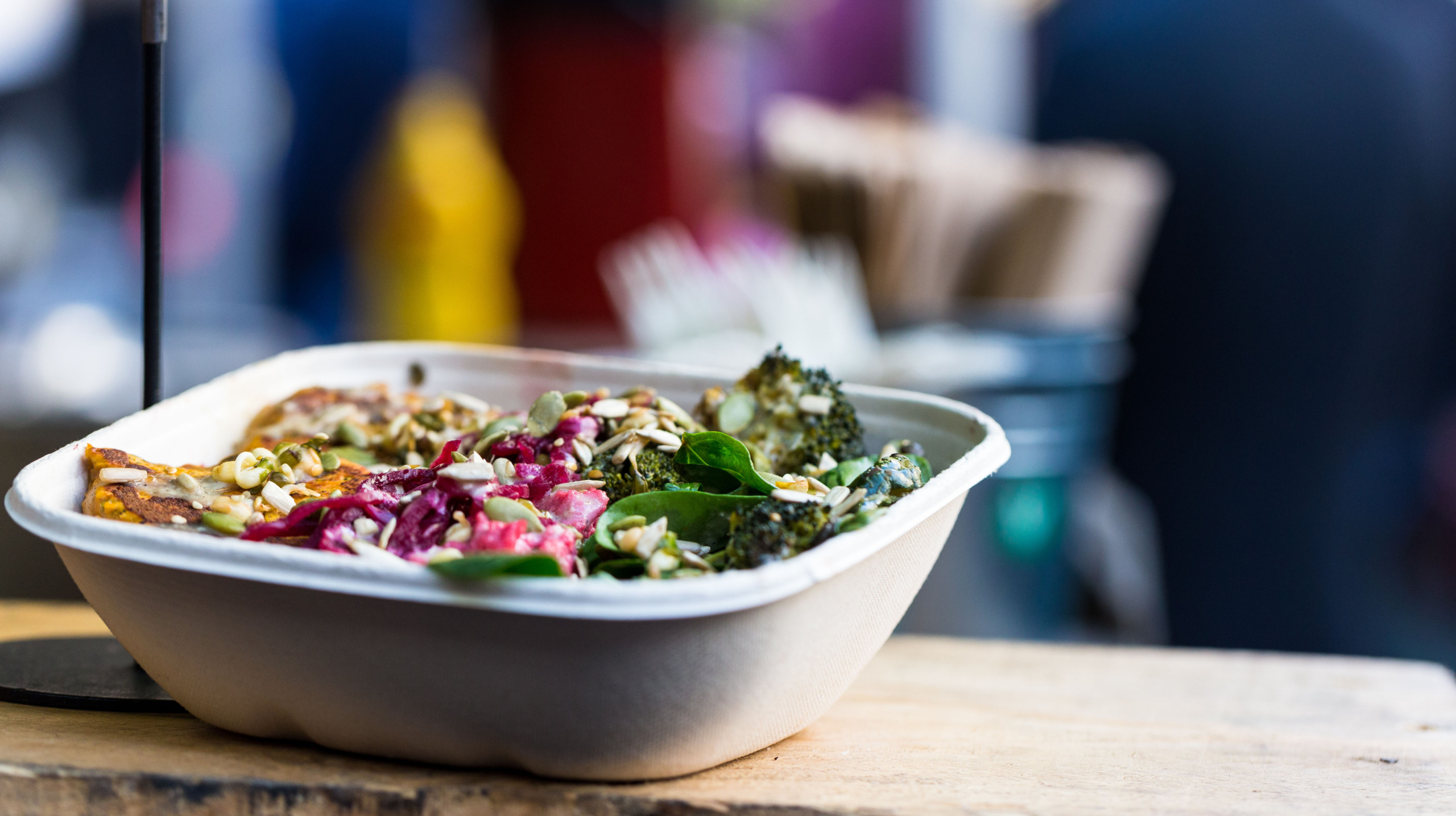 Close up of vegan vegetarian take away food for sale at Borough Market, London, UK