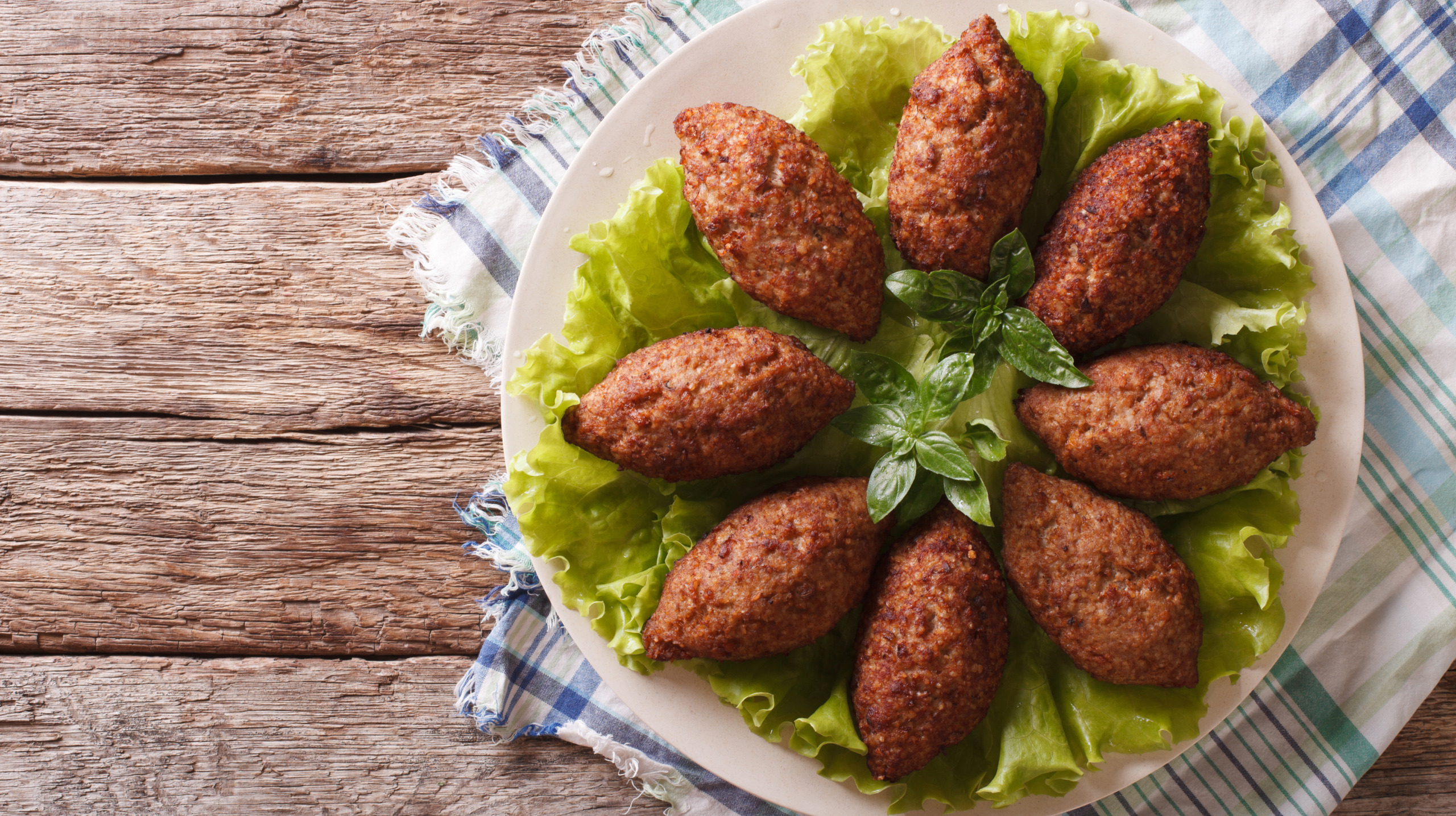 Arabic cuisine: meat appetizer kibbeh closeup on a plate