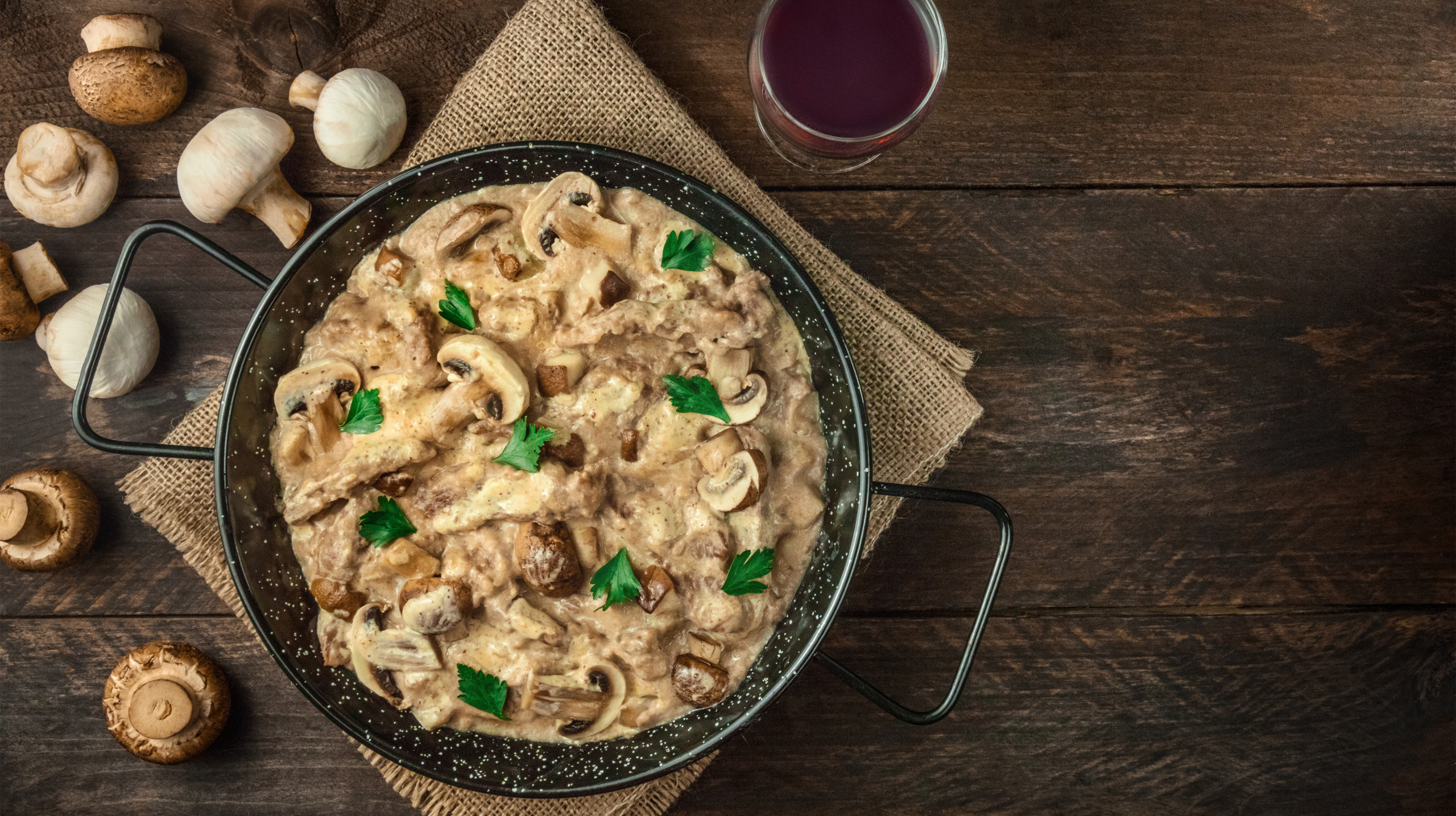 Mushroom beef stroganoff in pan with copy space