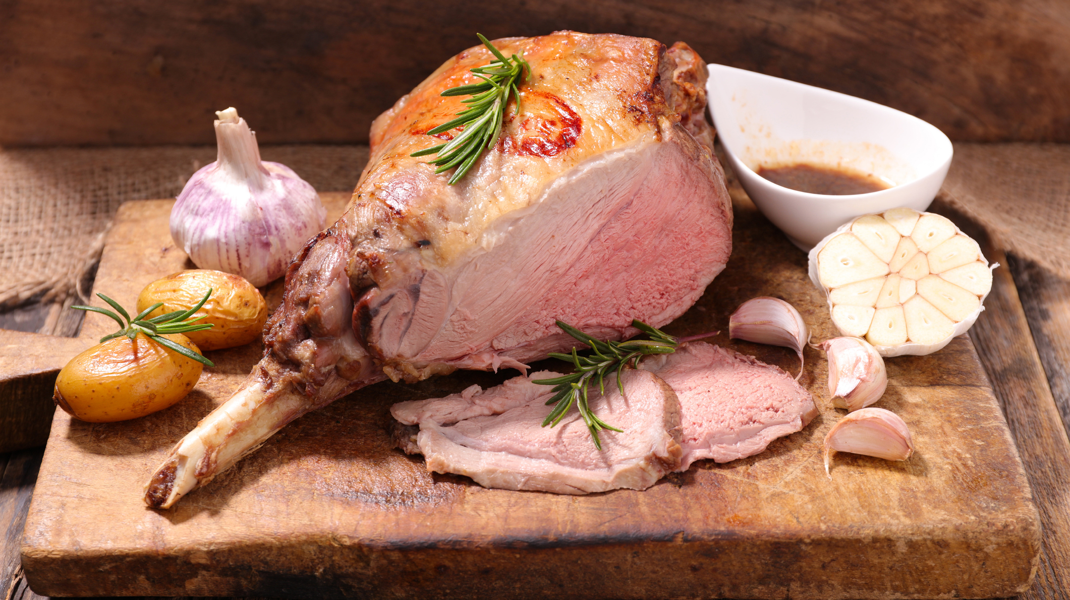 roasted lamb leg on board