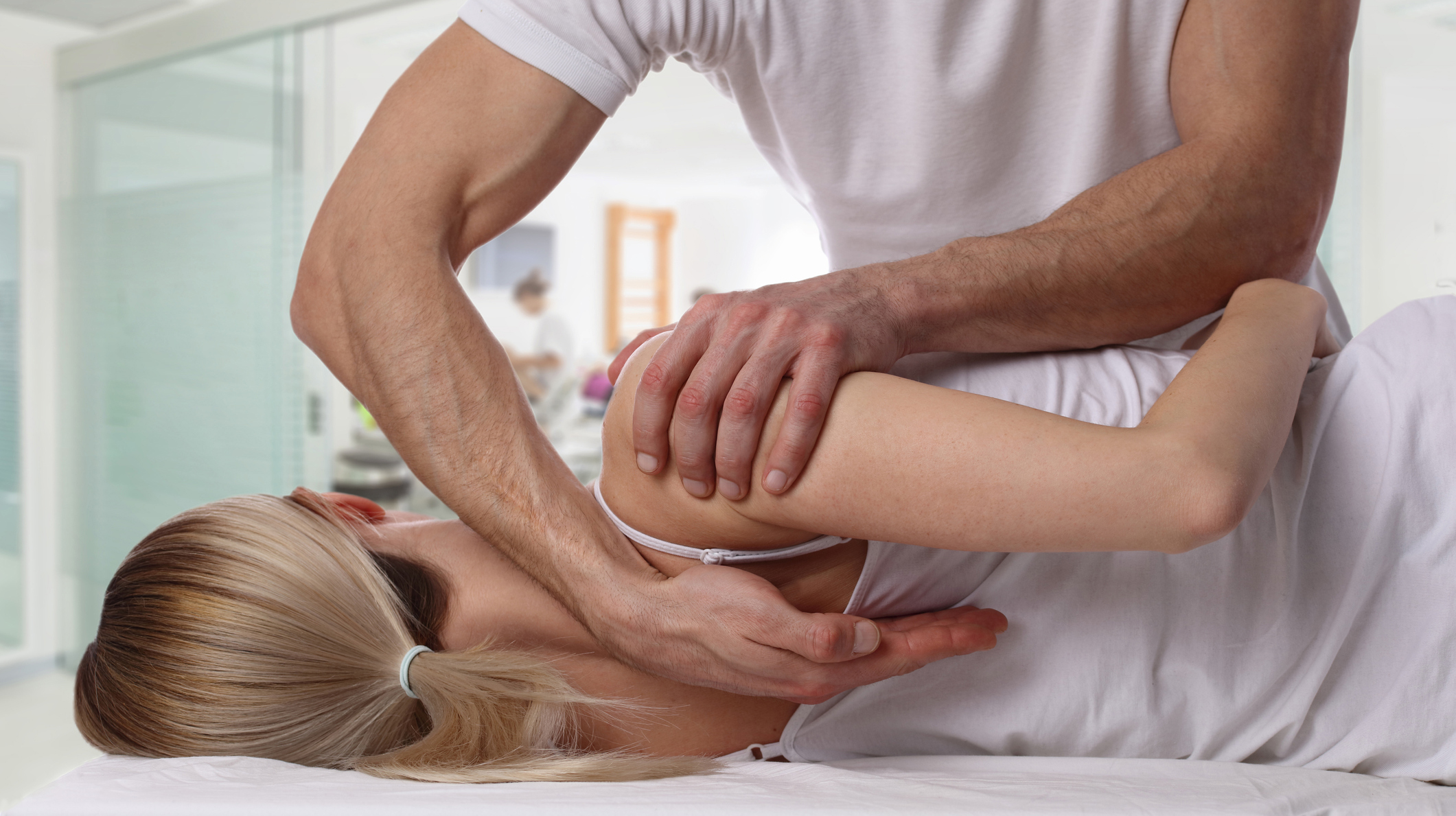Woman having chiropractic back adjustment. Osteopathy, Alternative medicine, pain relief concept. Physiotherapy, sport injury rehabilitation