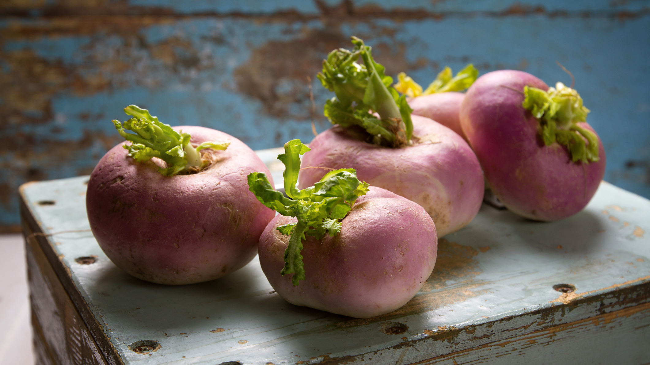 Fresh turnips on an old wooden box