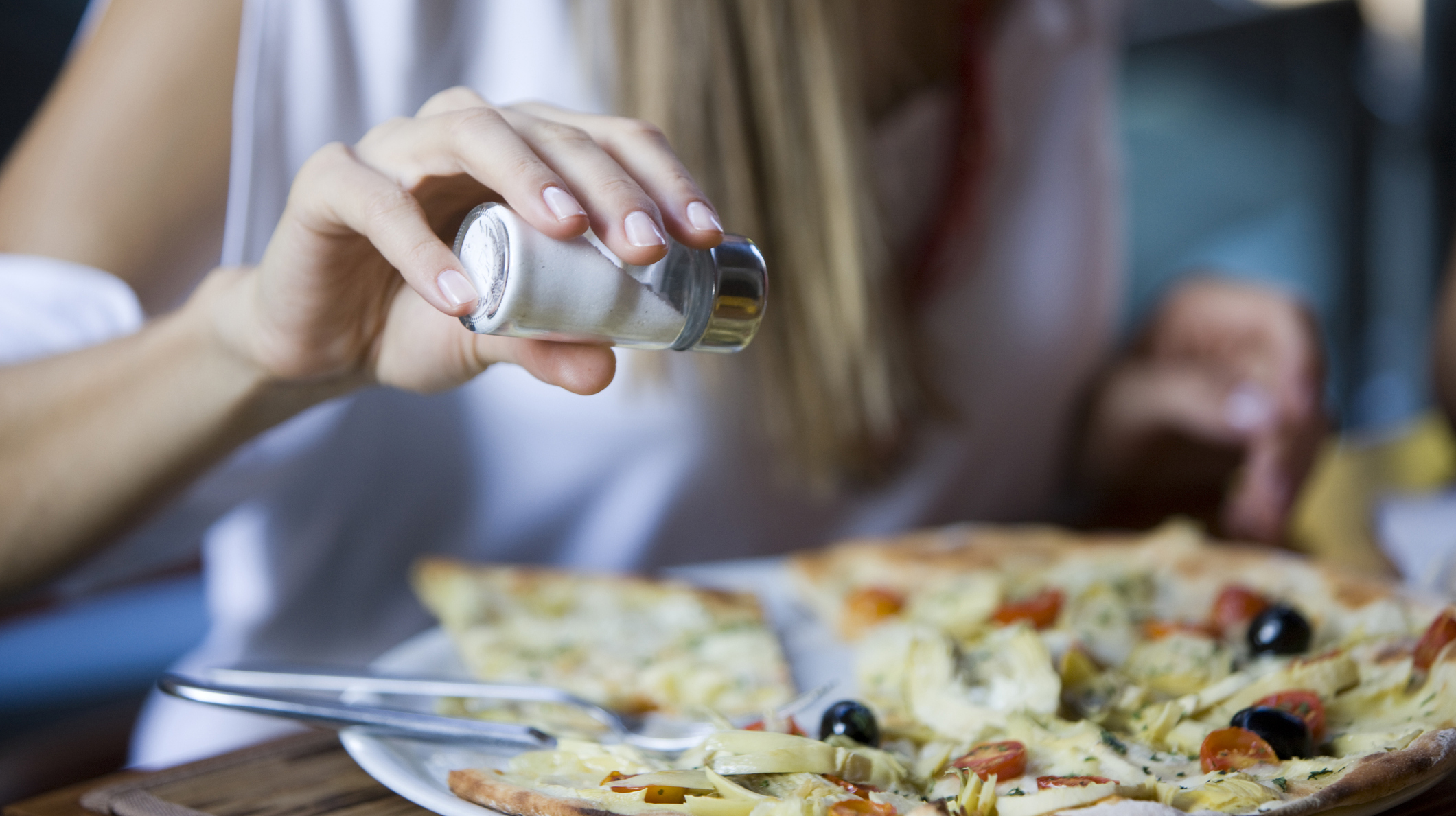 Salting pizza