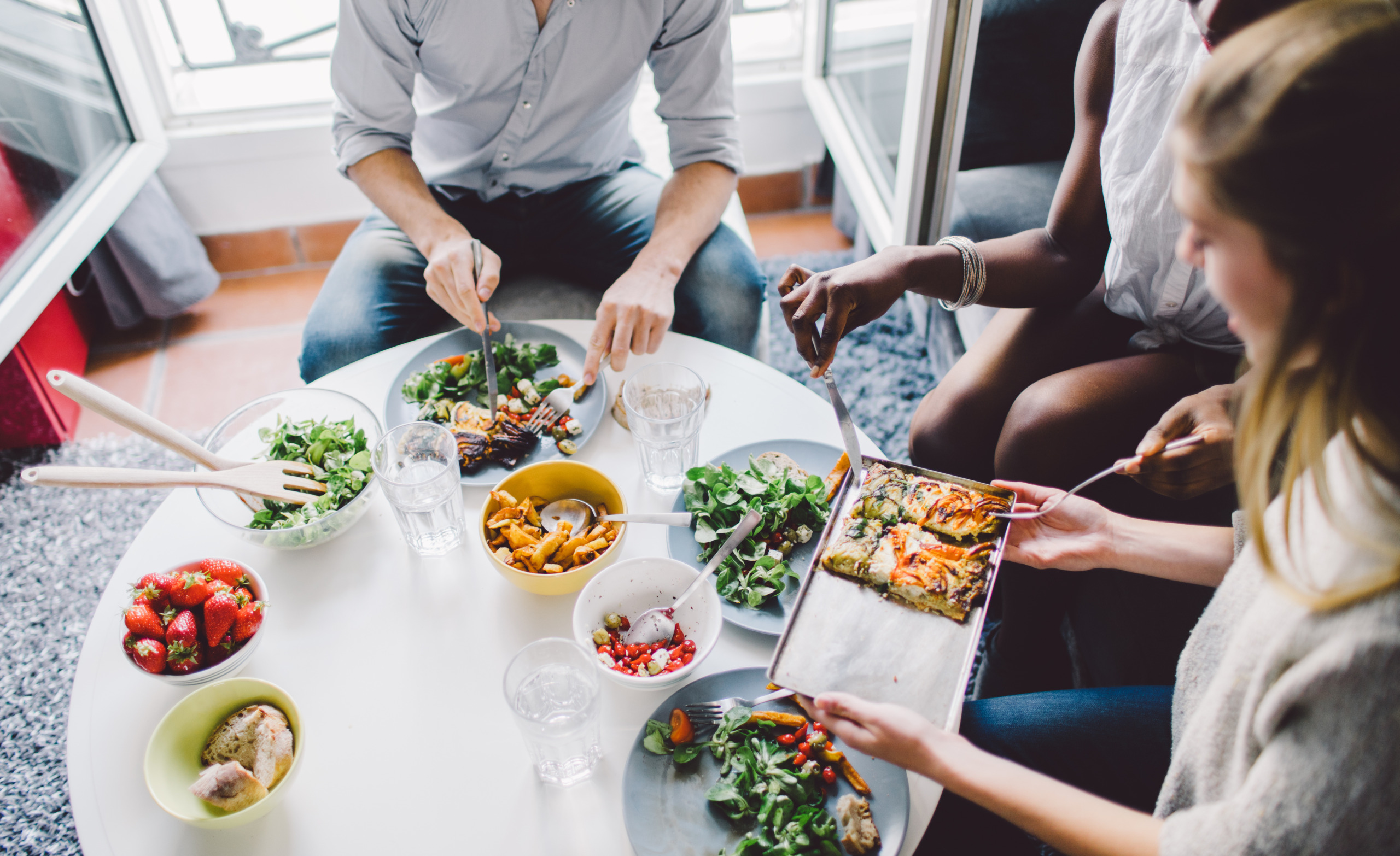 Friends enjoying lunch at home