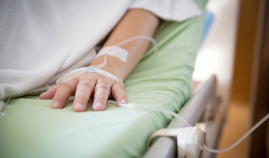 Focus patient’s hand has get the saline solution syringe on it. Illness and treatment. Health insurance plan.