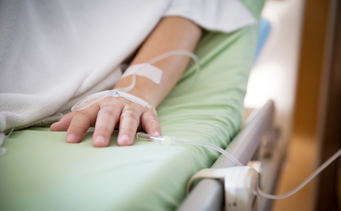 Focus patient’s hand has get the saline solution syringe on it. Illness and treatment. Health insurance plan.
