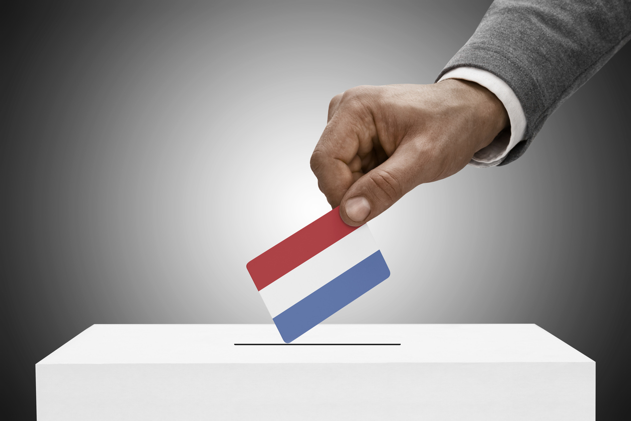 Black male holding flag. Voting concept – Netherlands