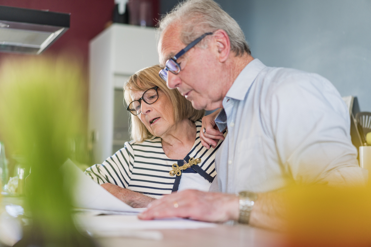 Senior couple calculating home finance
