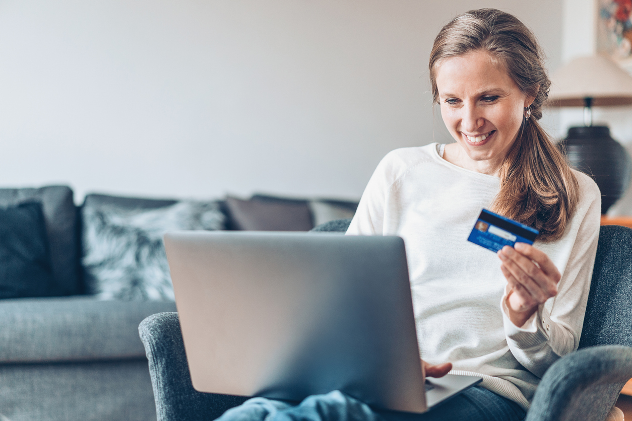 Smiling woman shopping on-line