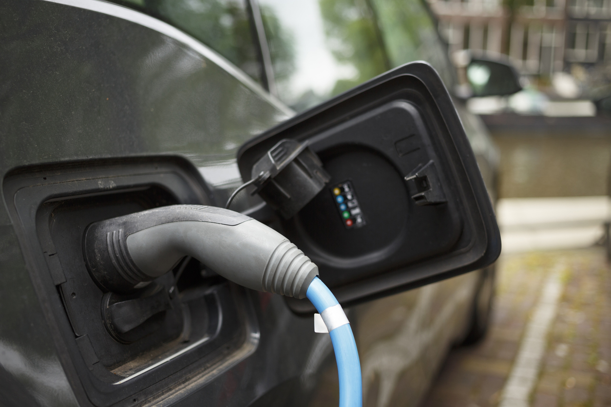 Charging electrical car batteries on electric vehicle charging station.