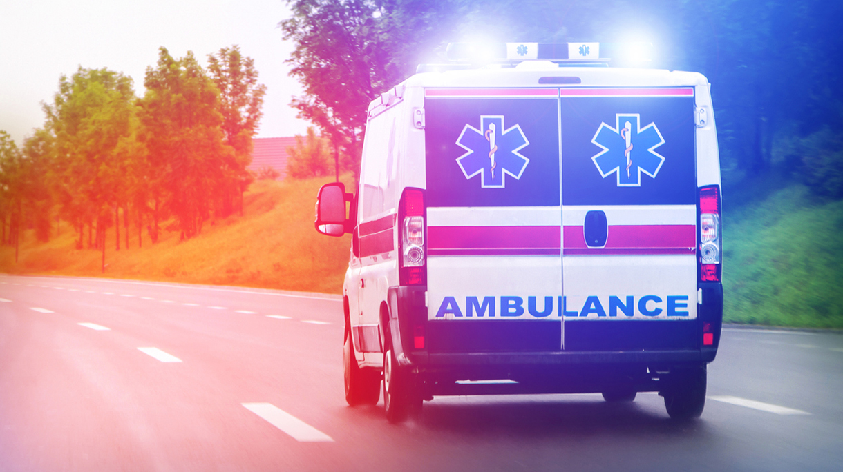 Ambulance van on highway with flashing lights