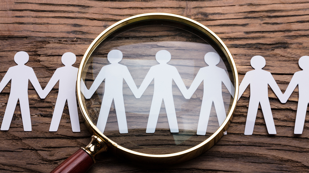 Magnifying Glass On Cut-out Figures
