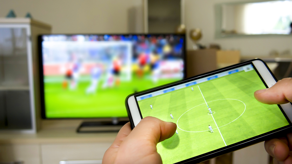 Playing soccer on a TV with a smartphone