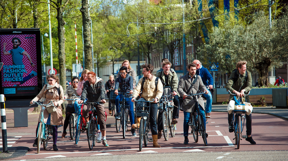 Many cyclists on Amsterdam street in Netherlands