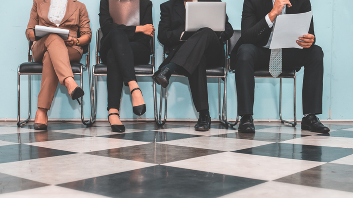 Low Section Of People Waiting For Interview On Chair