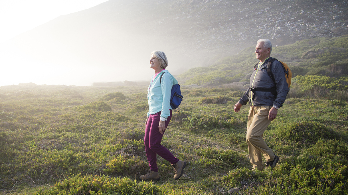 Senior couple walking outdoors together