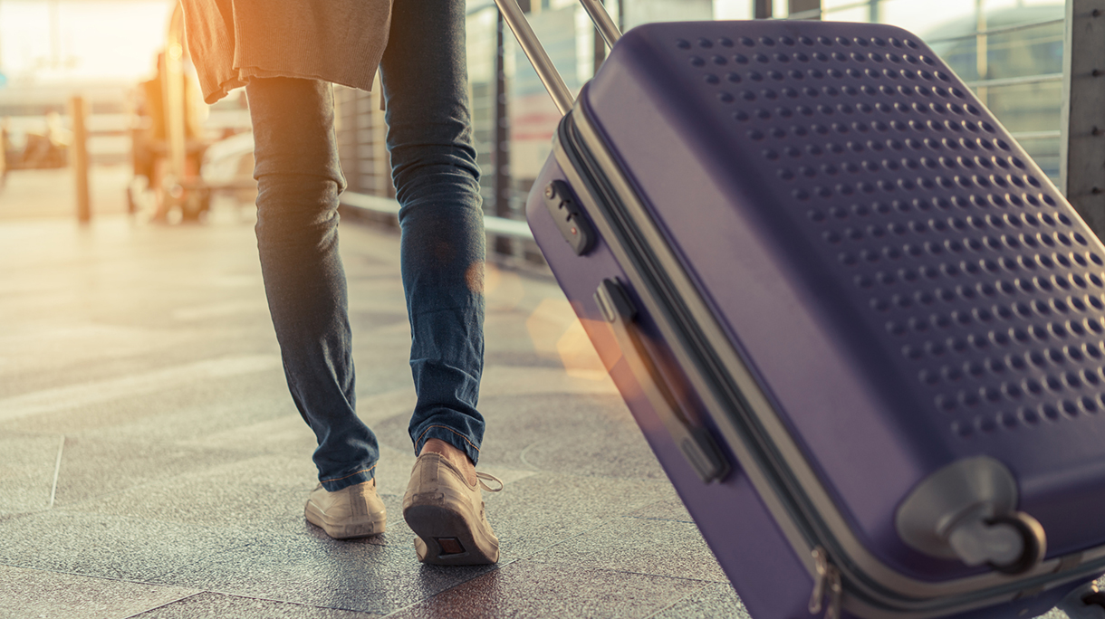 Low Section Of Woman Walking On Airport