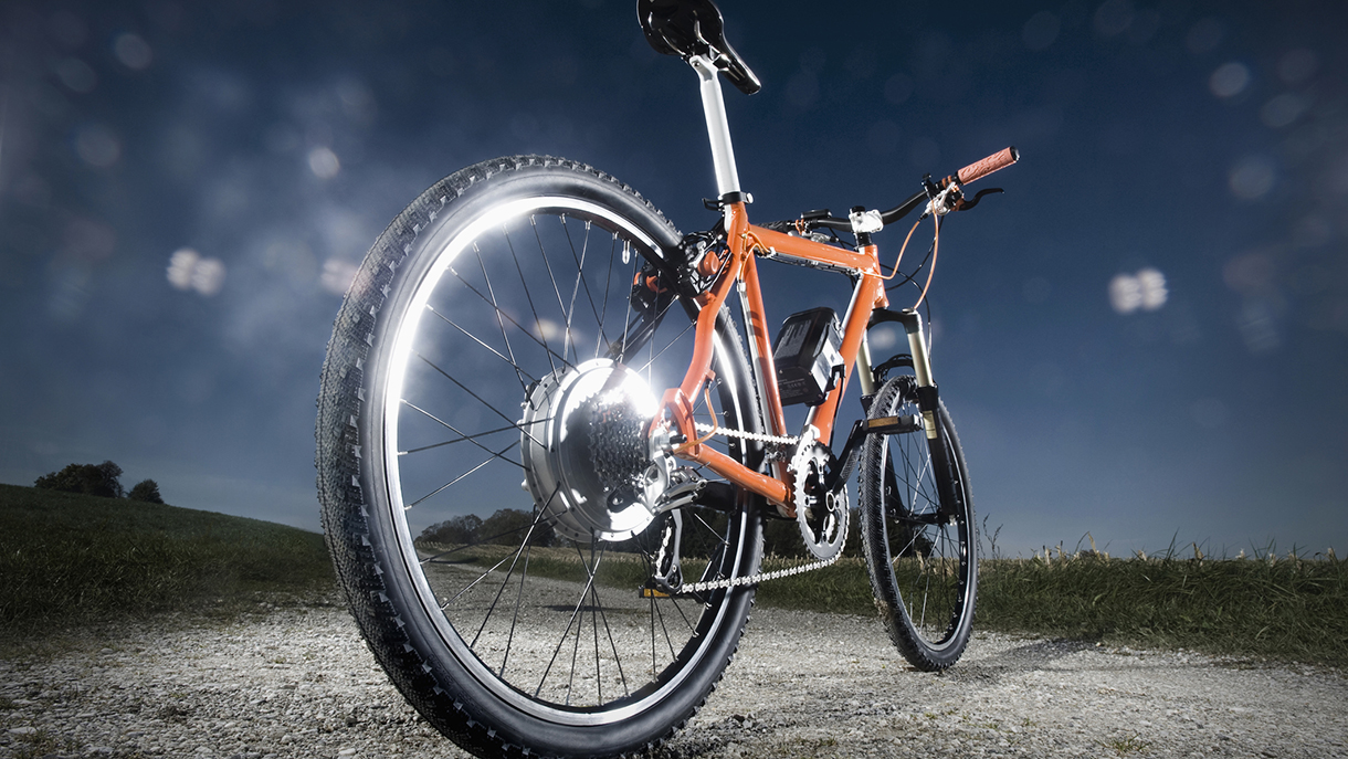 Electric bicycle standing on field