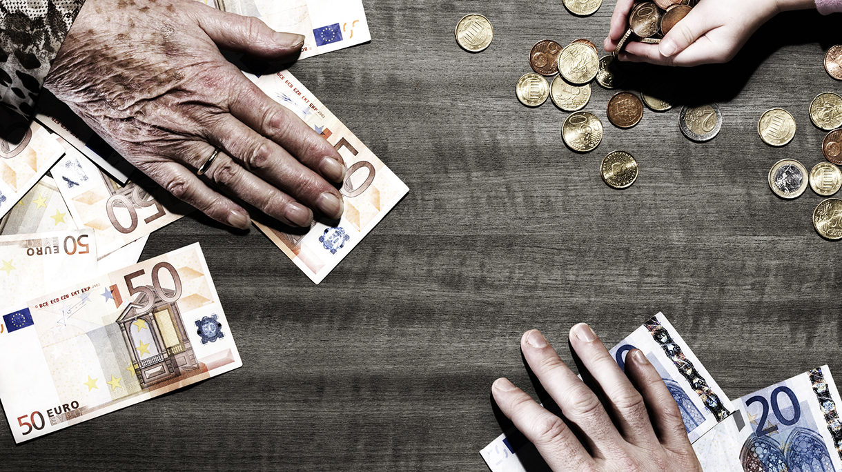 3 people’s hands with money on table