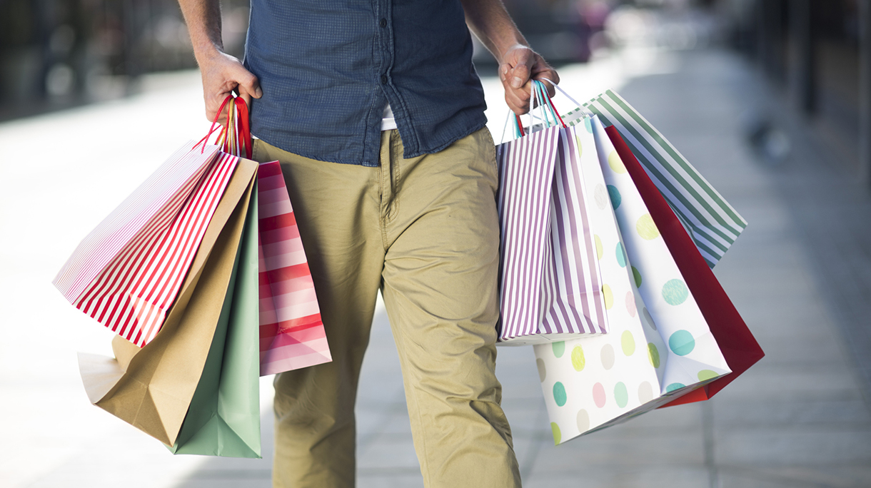 Man carrying lots of shopping bags
