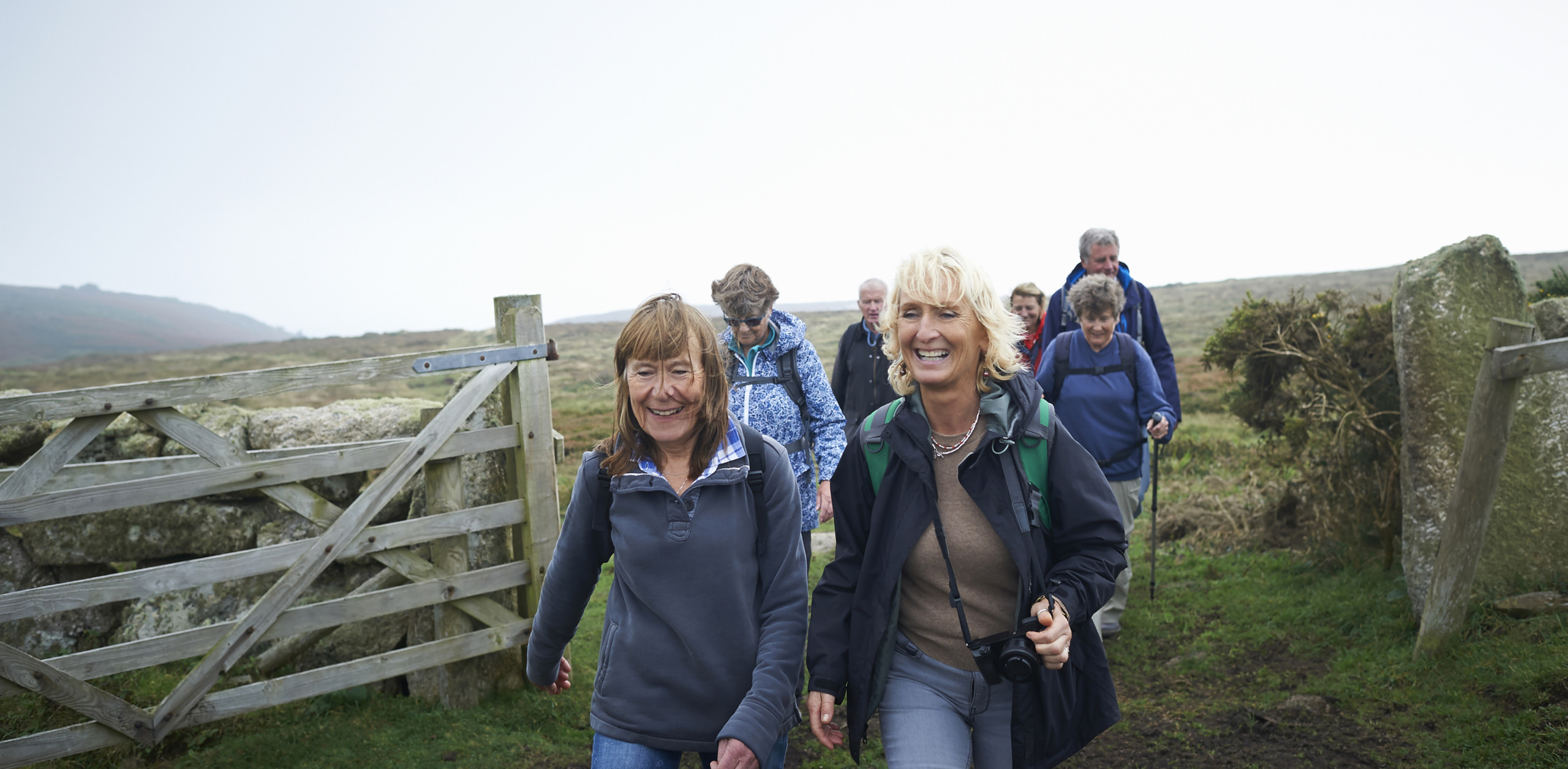 Senior ramblers hiking in countryside.