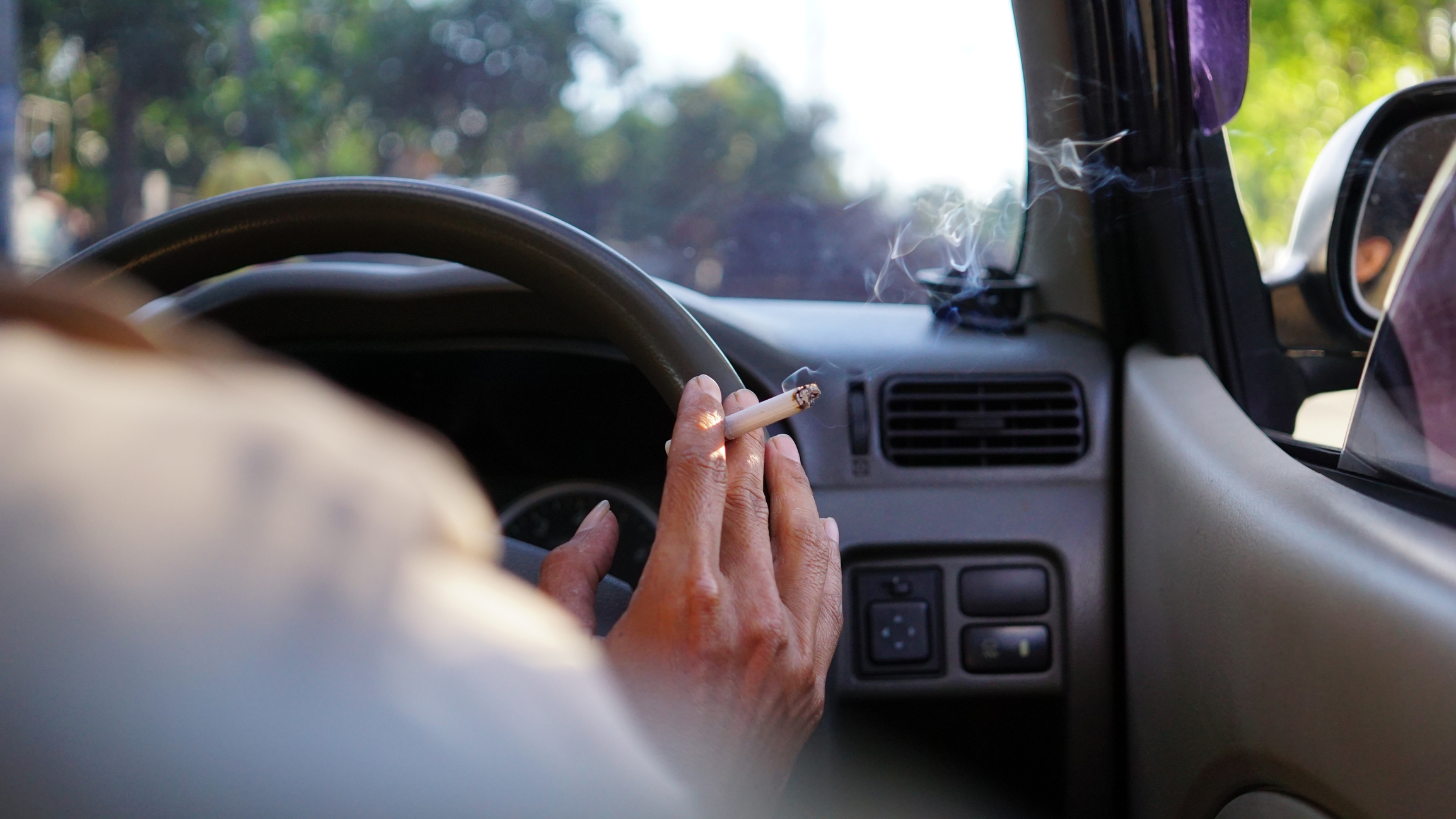 Smoking while driving a car