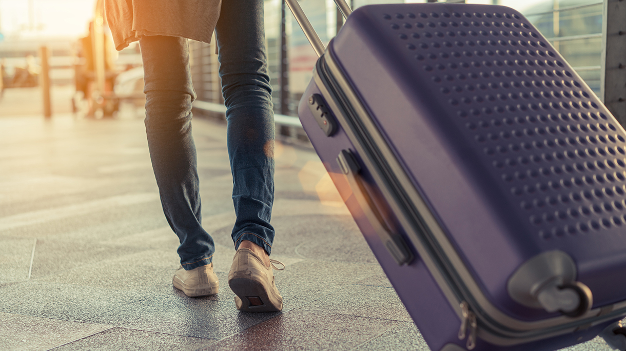 Low Section Of Woman Walking On Airport