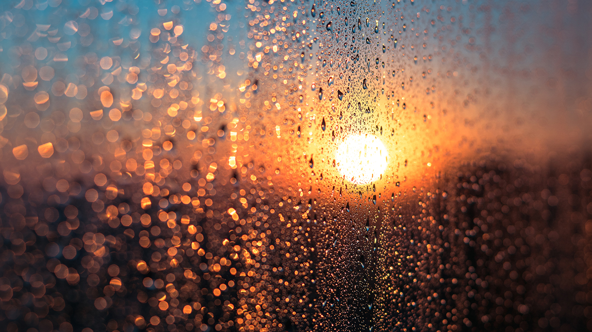 Winter Sunrise with Condensation Water Dew on Window