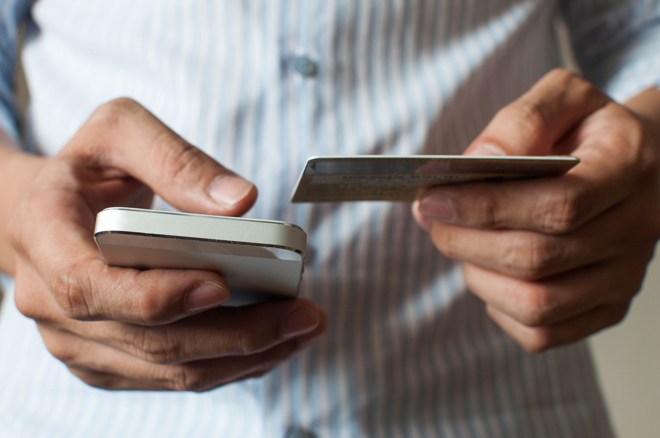 A businessman is buying online