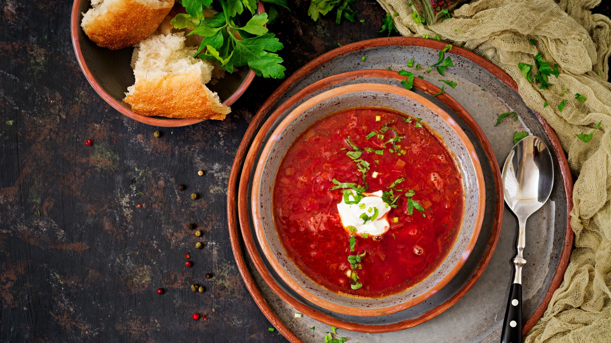 Traditional Ukrainian Russian borscht with beef on the bowl. Top view